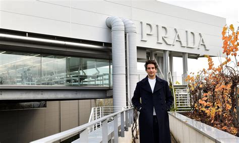 Son set to take over Prada empire says he's open to buying 